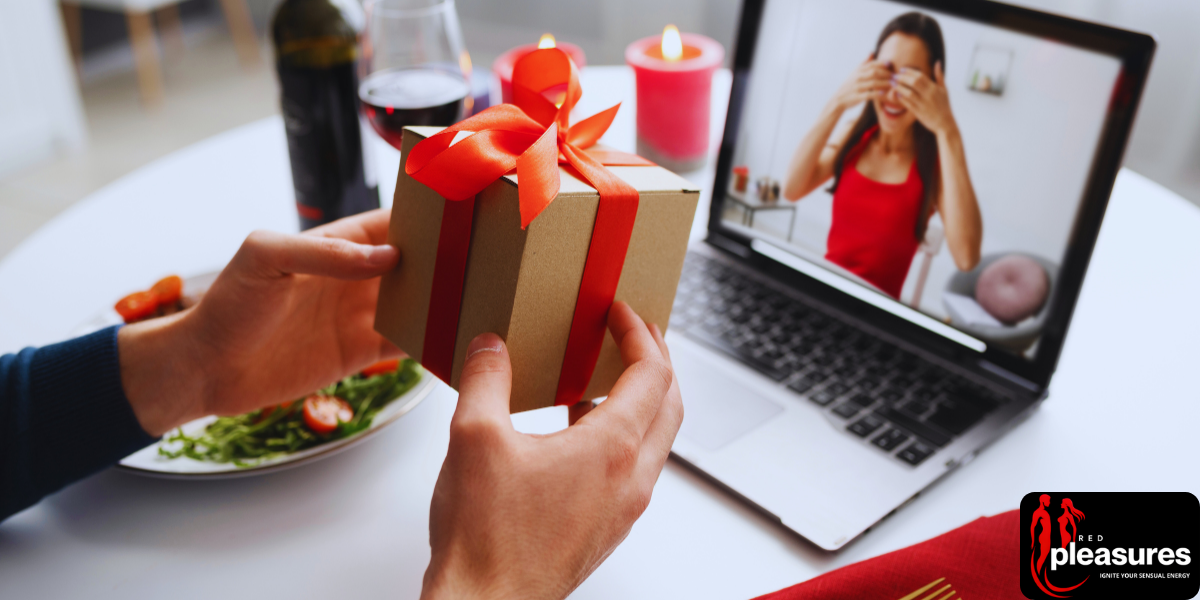 Hands holding a wrapped gift with a red bow in front of a laptop during a virtual Valentine's date.