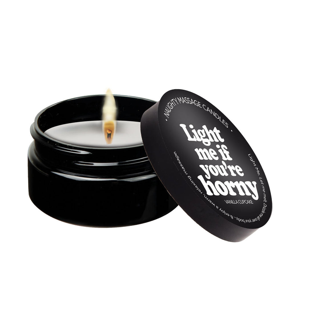 Vanilla scented massage candle with a lit wick and open lid.