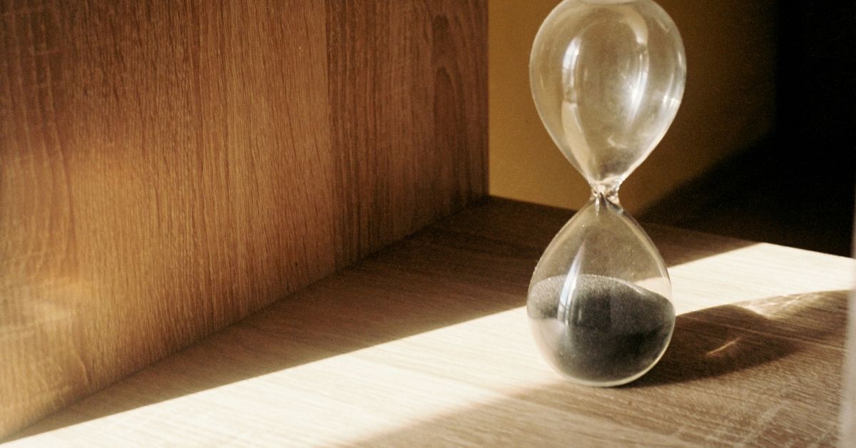 Orgasm denial and edging guide — hourglass symbolizing anticipation and timing, from Red Pleasures