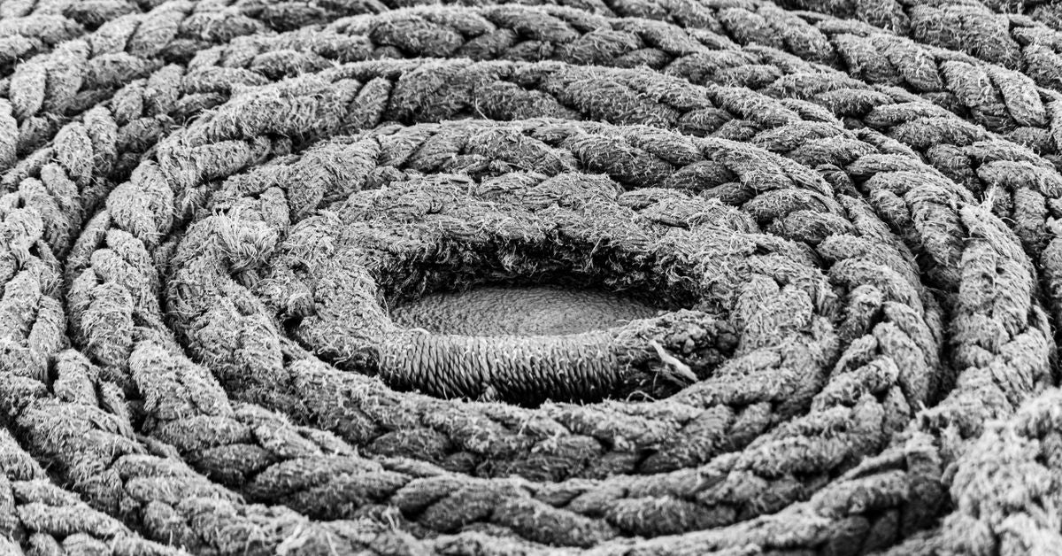 Coiled rope in monochrome - BDSM toys and types of play explained by Red Pleasures