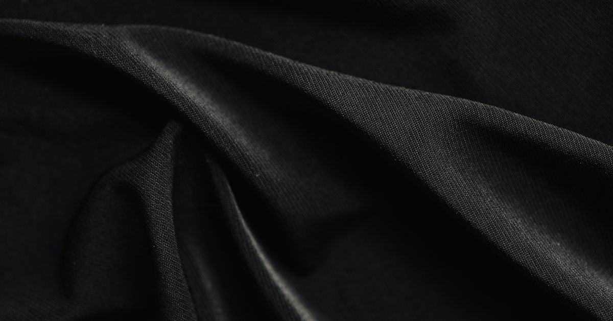 BDSM masks, hoods and blindfolds sensory play guide - folds of black satin fabric