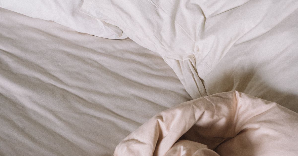 Anal sex positions guide — pillows and soft bedding still life, comfort-first setups from Red Pleasures