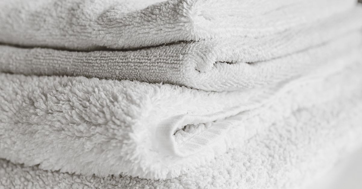 How to clean a pocket pussy — folded towels representing toy care and drying, Red Pleasures Canada