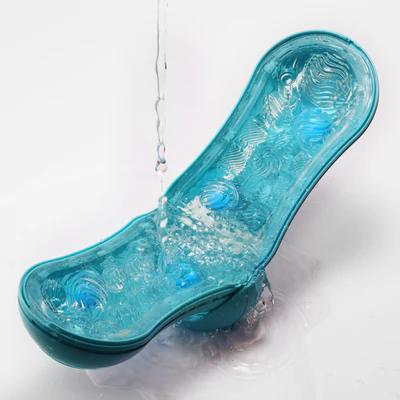 Tenga Flip Orb Ocean Blue male masturbator with water pouring over it.