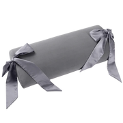 Grey microvelvet half-moon bolster pillow with silk sashes.