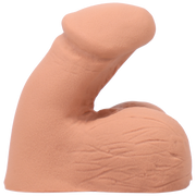 A peach-colored silicone packer with a realistic texture and shape.