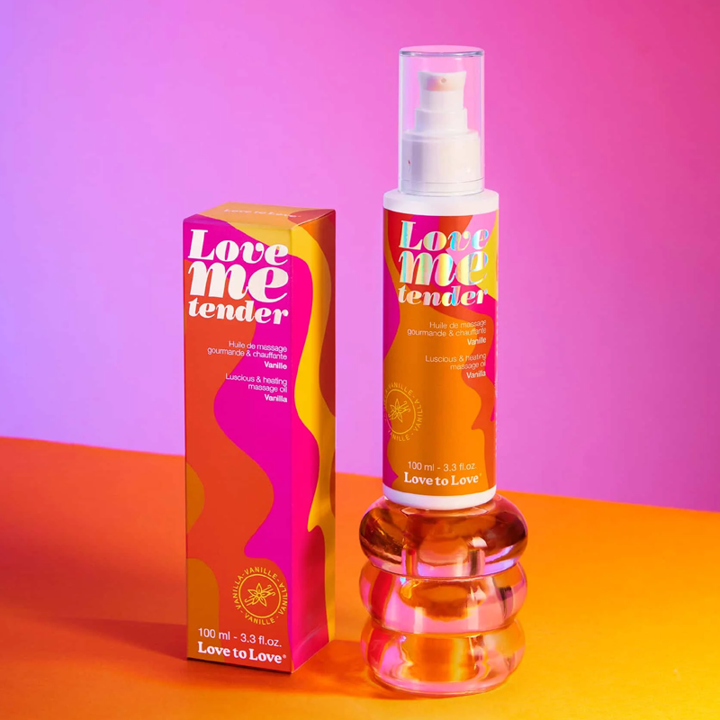 Love Me Tender vanilla warming massage oil bottle and box.