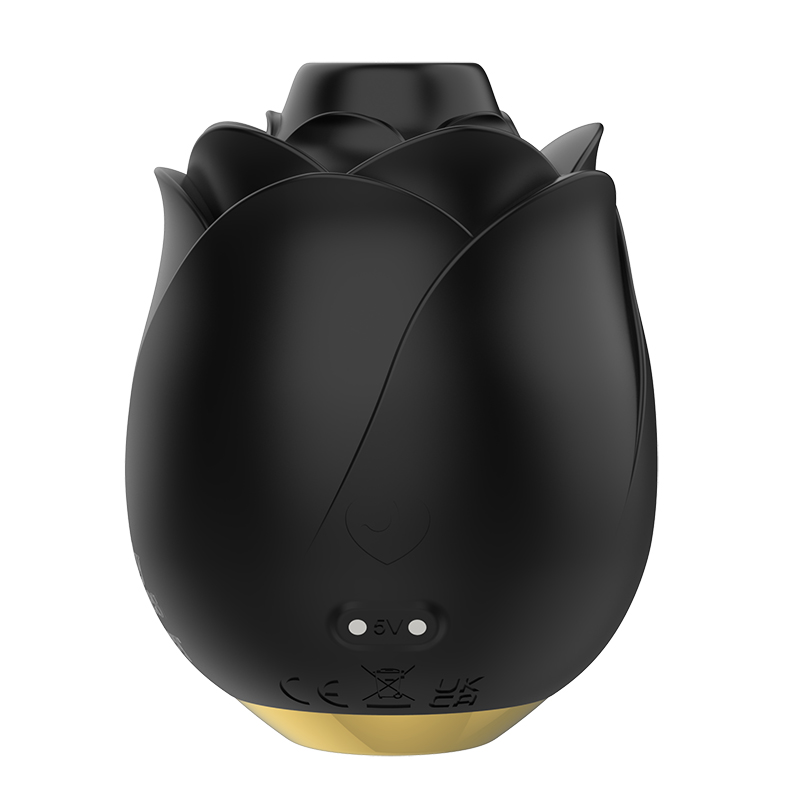 Black rose-shaped vibrator with gold base and charging indicators.