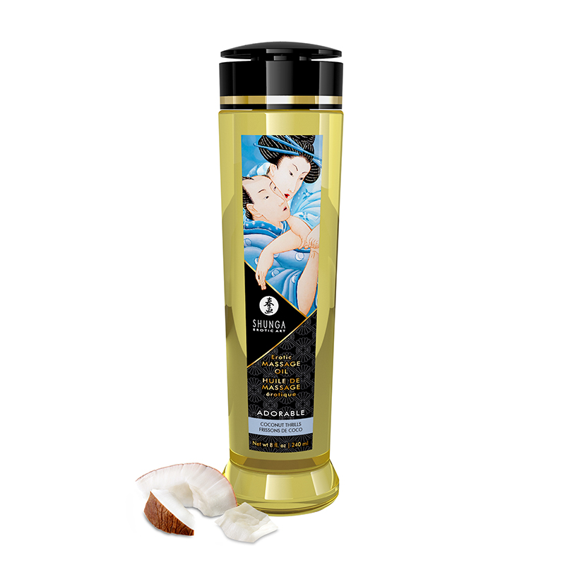 Shunga Coconut Thrills massage oil in a clear bottle with a label featuring an erotic illustration.