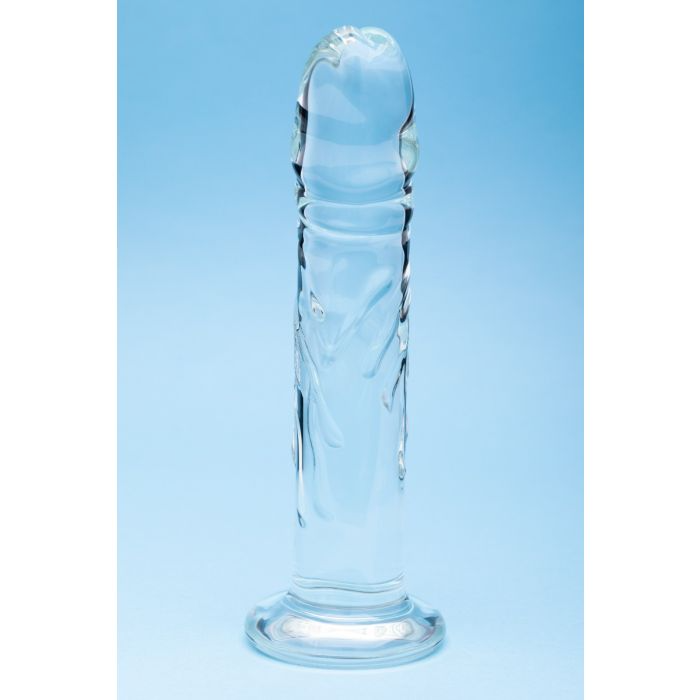 Clear borosilicate glass dildo with sculpted contours and a flared base.