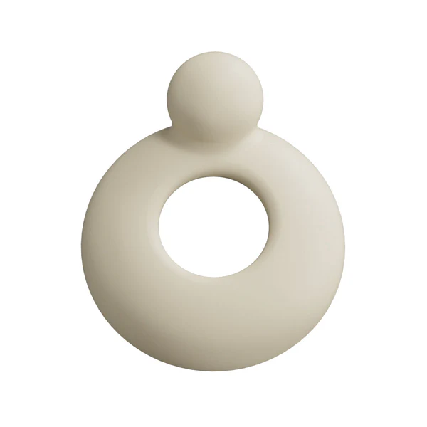 A beige, ring-shaped vibrator with a small ball on top.