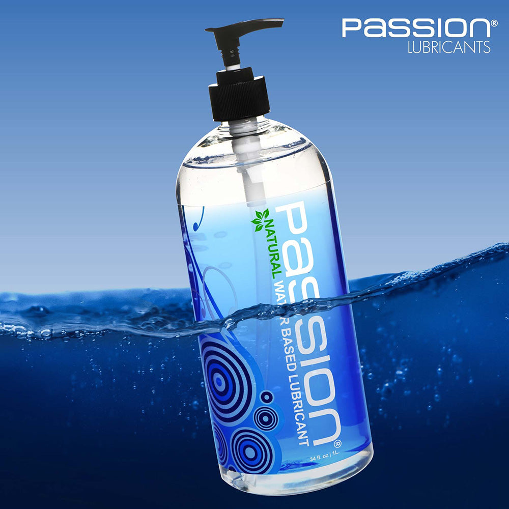 A bottle of Passion Natural Water-Based Lubricant with a pump dispenser, partially submerged in water.