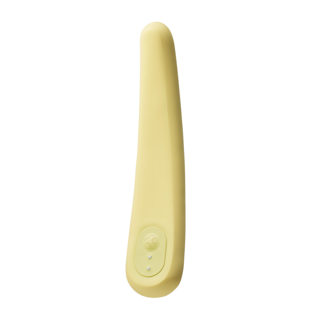A pale yellow silicone vibrator with a curved shape and a control button.