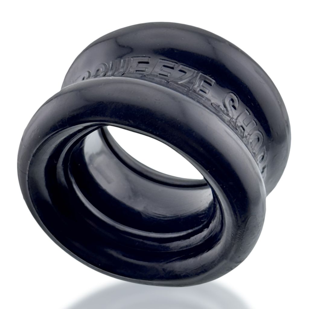 Black rubber ball stretcher with "SQUEEZE SHOP" embossed on it.