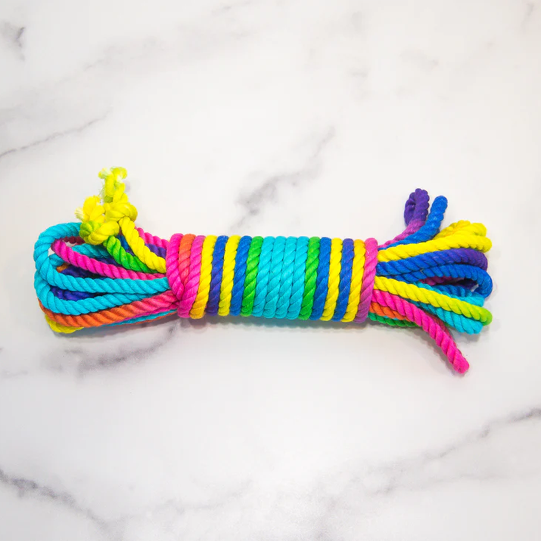 Rainbow bamboo silk bondage rope with vibrant colors.