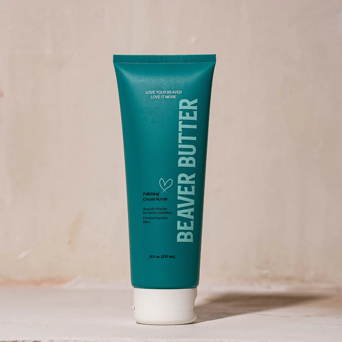 A teal tube of Beaver Butter Polishing Cream Scrub with white cap.