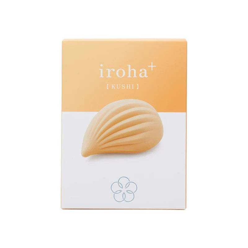 A ribbed, peach-colored silicone vibrator on a box with the Iroha logo.