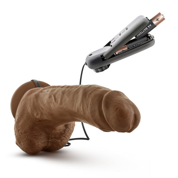 9-inch realistic vibrating dildo with suction cup base and batteries.