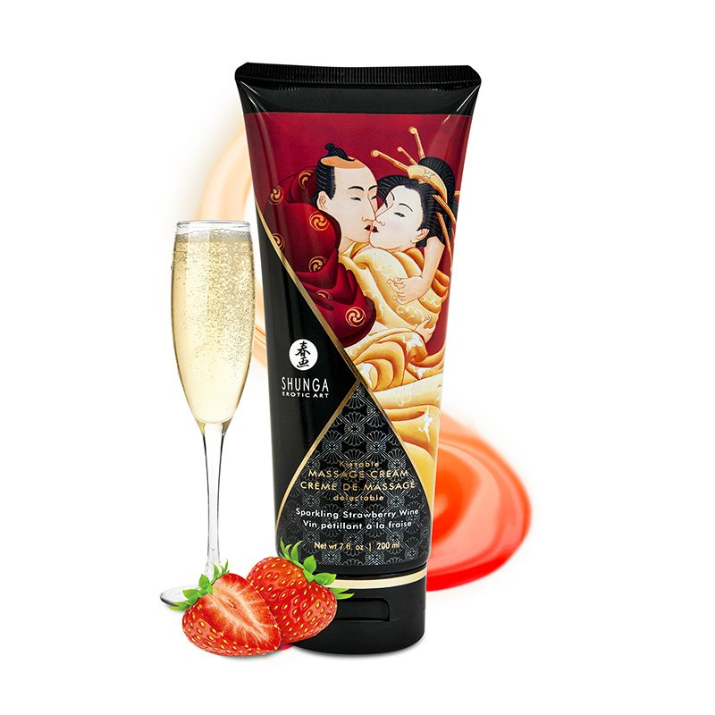 Shunga edible massage cream in sparkling strawberry wine flavor with a champagne flute and strawberries.