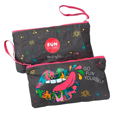 Two dark gray zippered pouches with colorful, playful designs and pink trim.