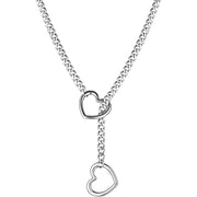 Silver chain necklace with two heart-shaped charms.