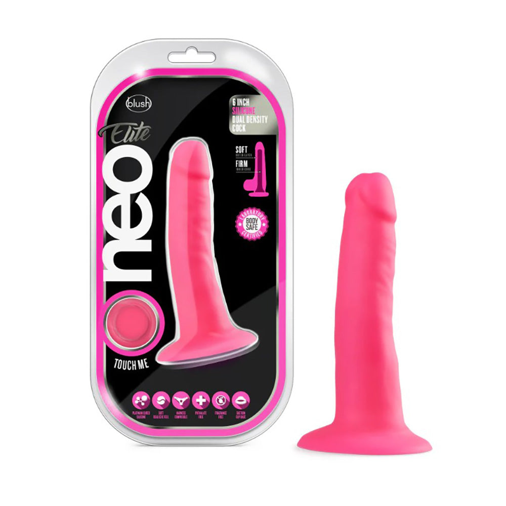Neon pink dual density silicone dildo with suction cup base on white packaging.