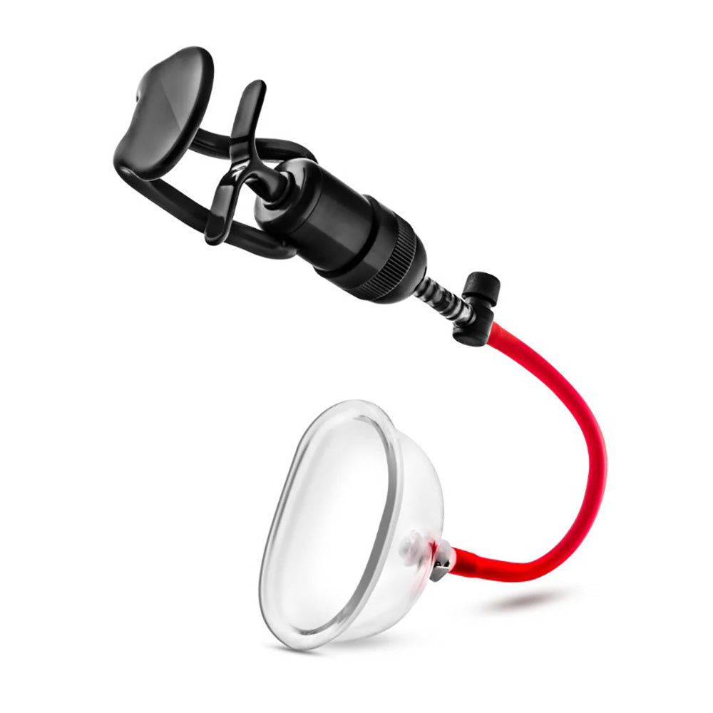 A black and clear pump system with a red tube and a 4-inch acrylic cup.