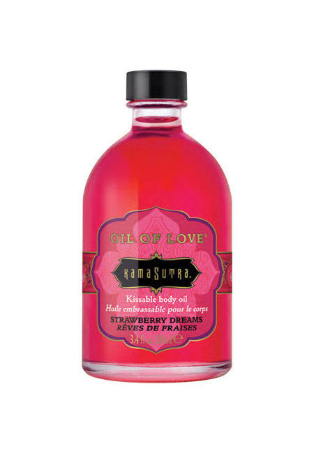Kama Sutra Strawberry Dreams warming body oil in a pink bottle.