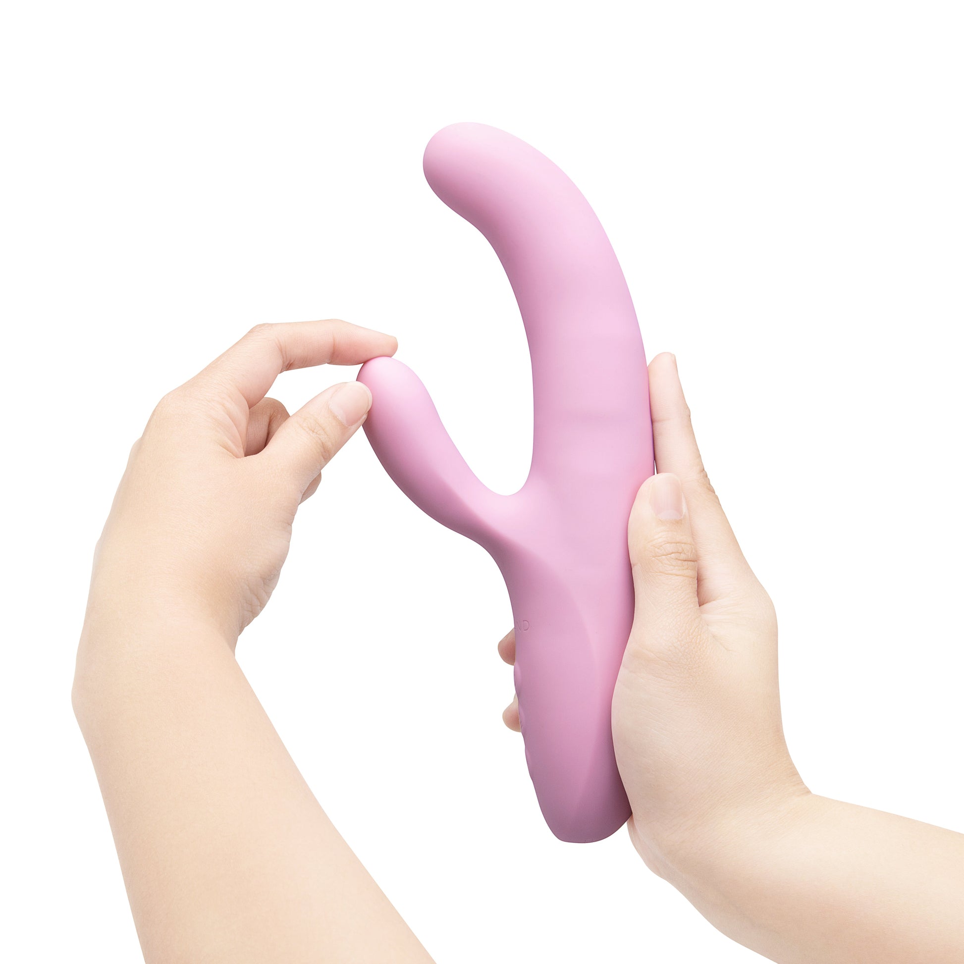 A pink rabbit-shaped G-spot vibrator held by two hands.
