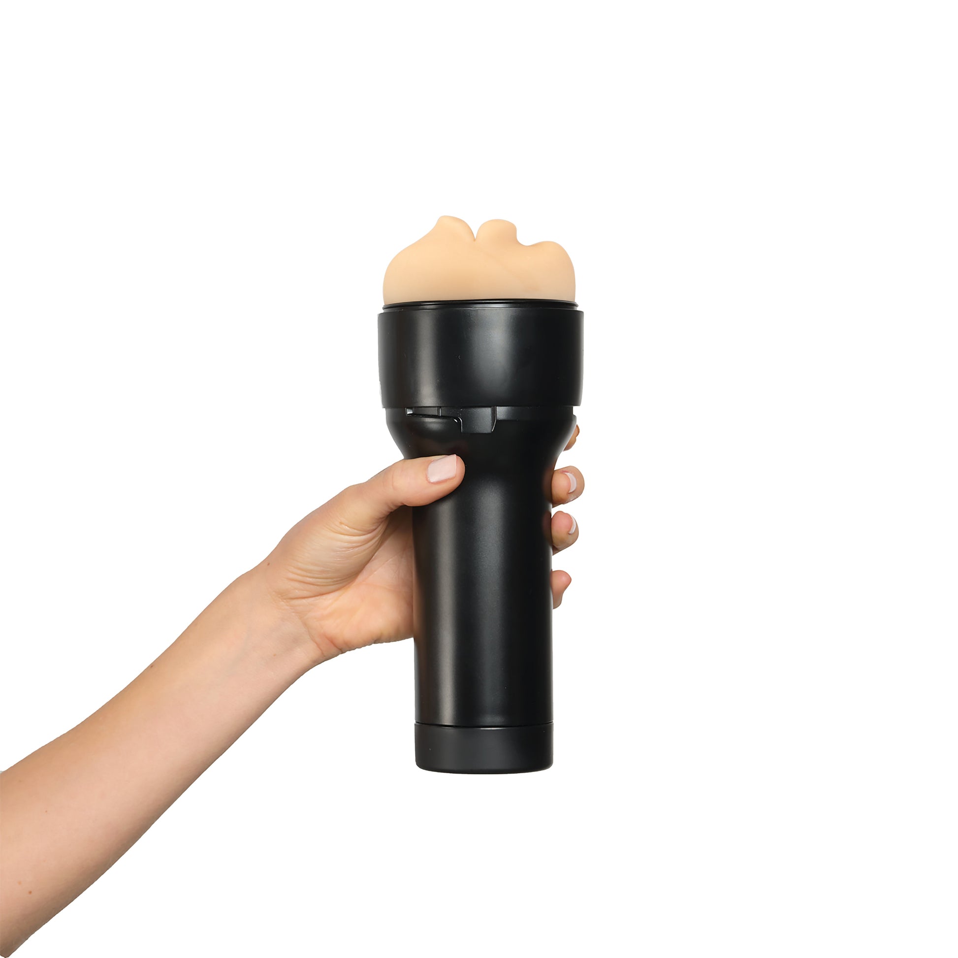 Hand holding a black realistic mouth stroker with a flesh-toned opening.