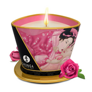 A Shunga scented massage candle with a pink and black design featuring Japanese art and roses.
