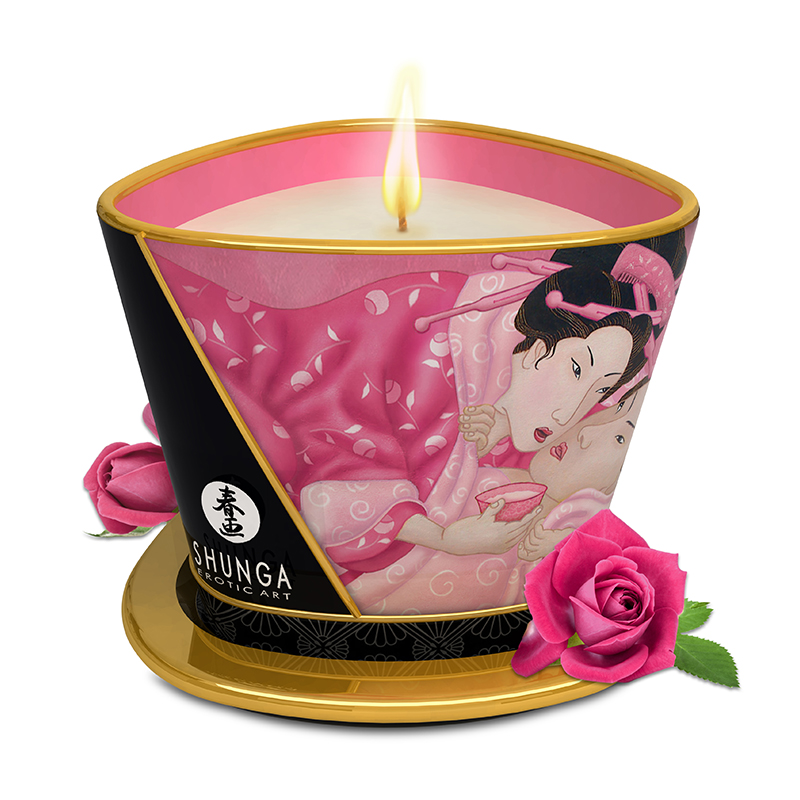 A Shunga scented massage candle with a pink and black design featuring Japanese art and roses.