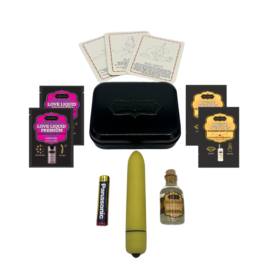 A Kama Sutra Weekender Kit with a yellow vibe, lubricants, cards, and a tin.