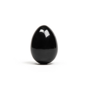 A polished black obsidian egg with a hole for string.