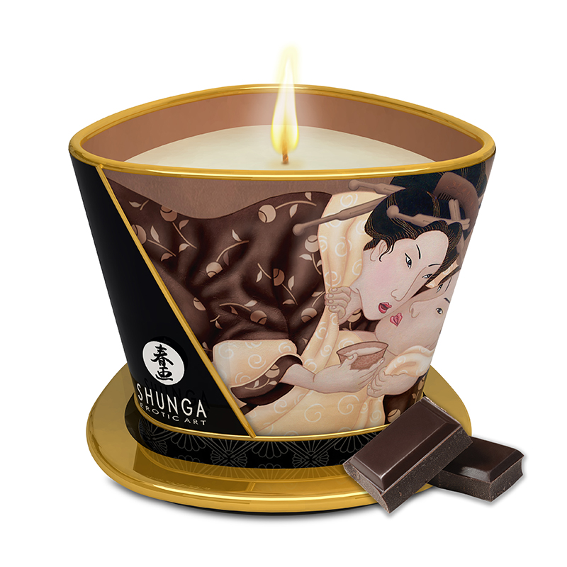 A Shunga chocolate massage candle with erotic art and two chocolate squares.