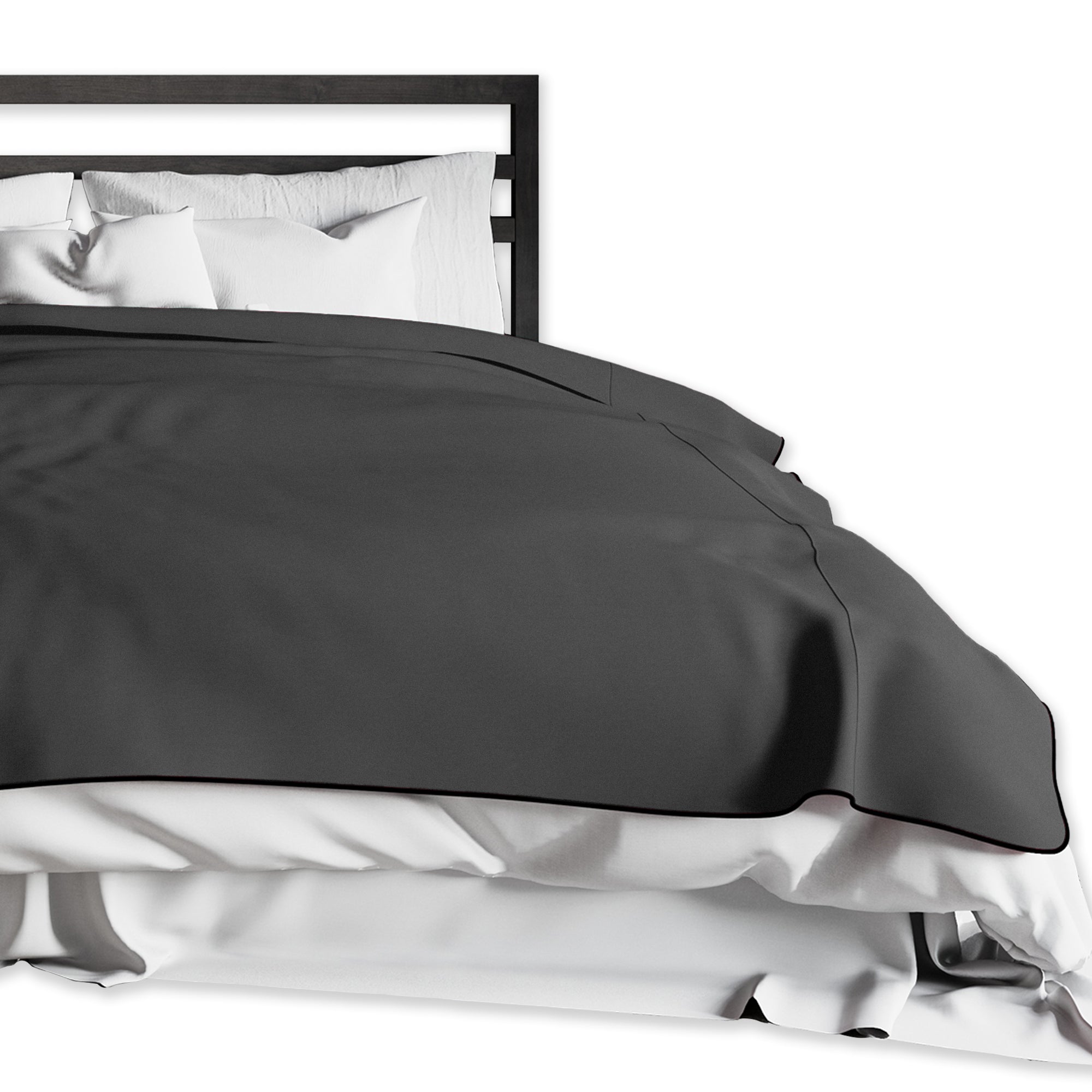 King size black waterproof microvelvet throw blanket on a bed.