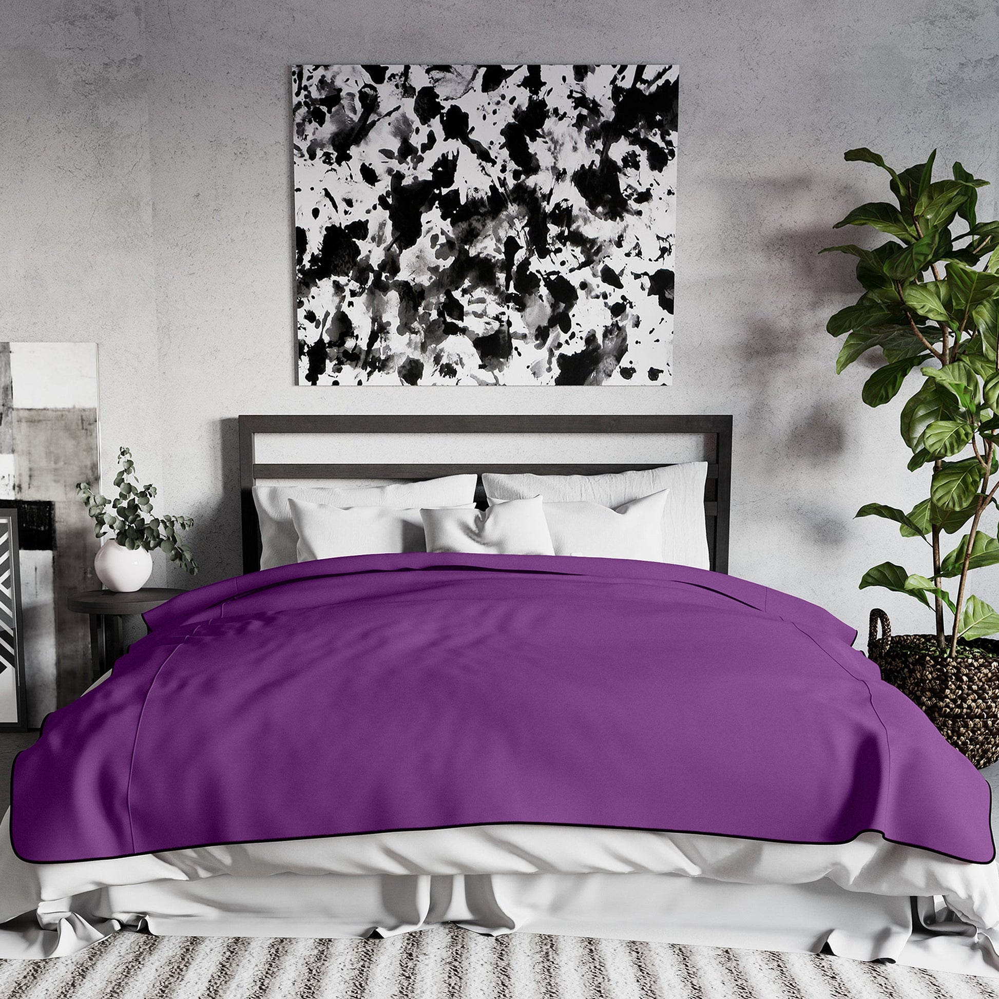 King size purple waterproof microvelvet throw blanket on a bed.