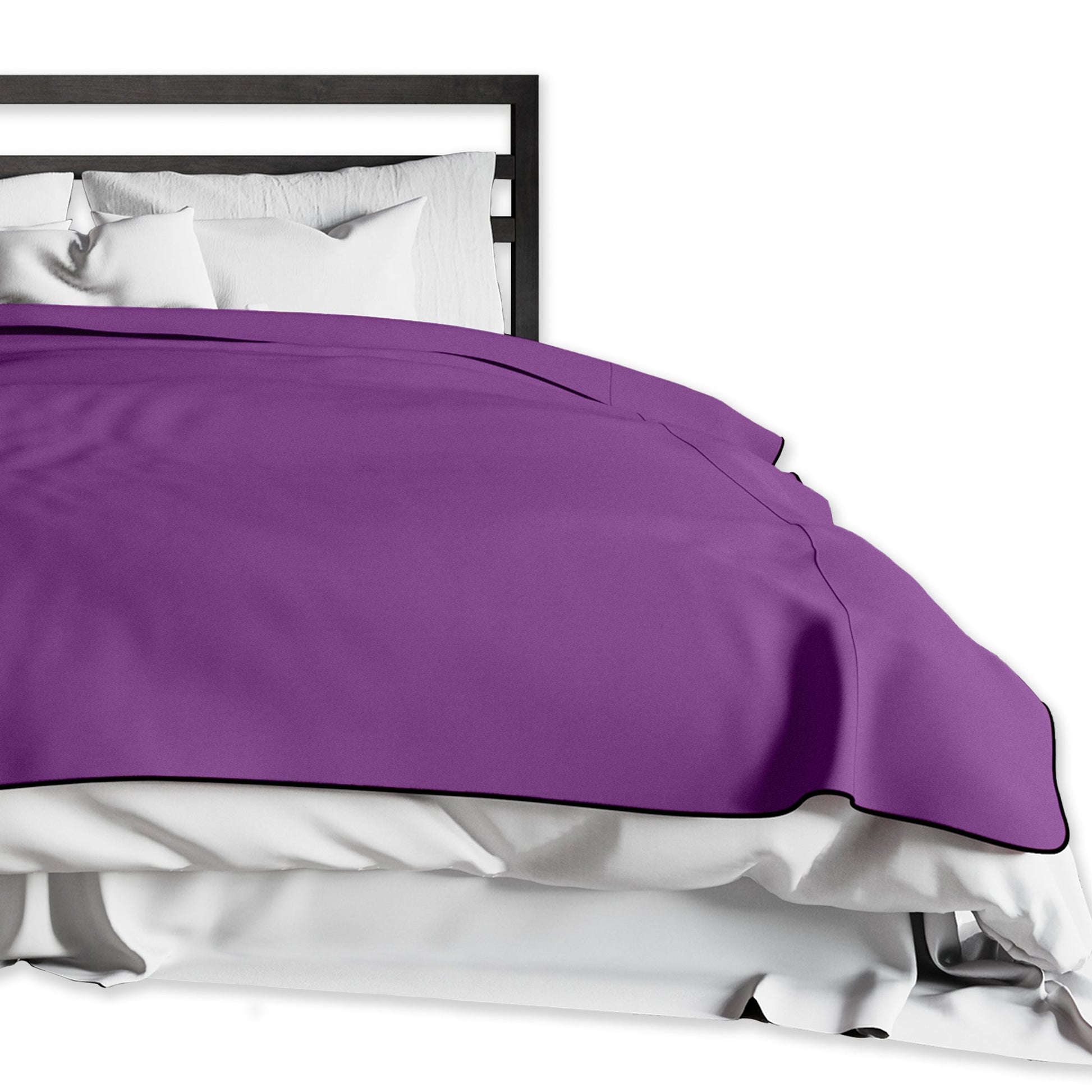 A king-size purple waterproof microvelvet throw blanket on a bed.