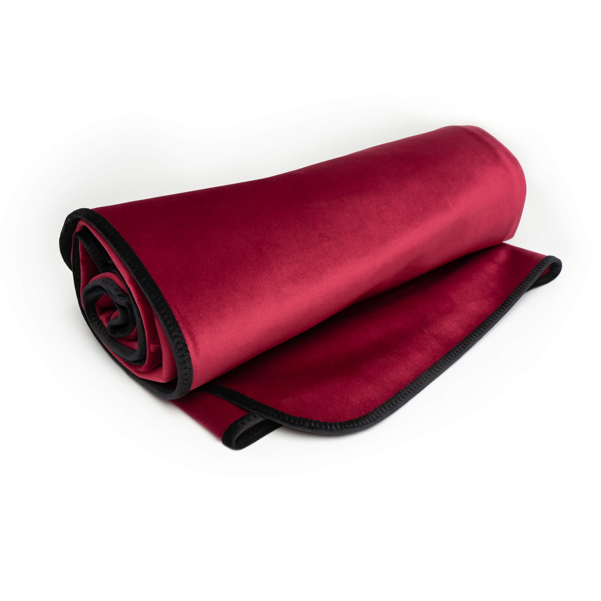 Rolled Merlot king size waterproof microvelvet throw blanket with black trim.