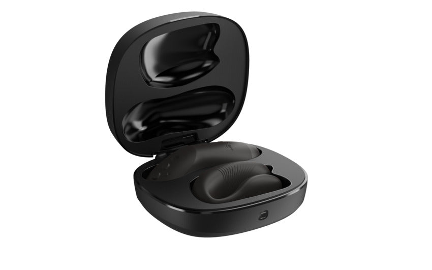 Black couples vibrator with haptic remote in open charging case.