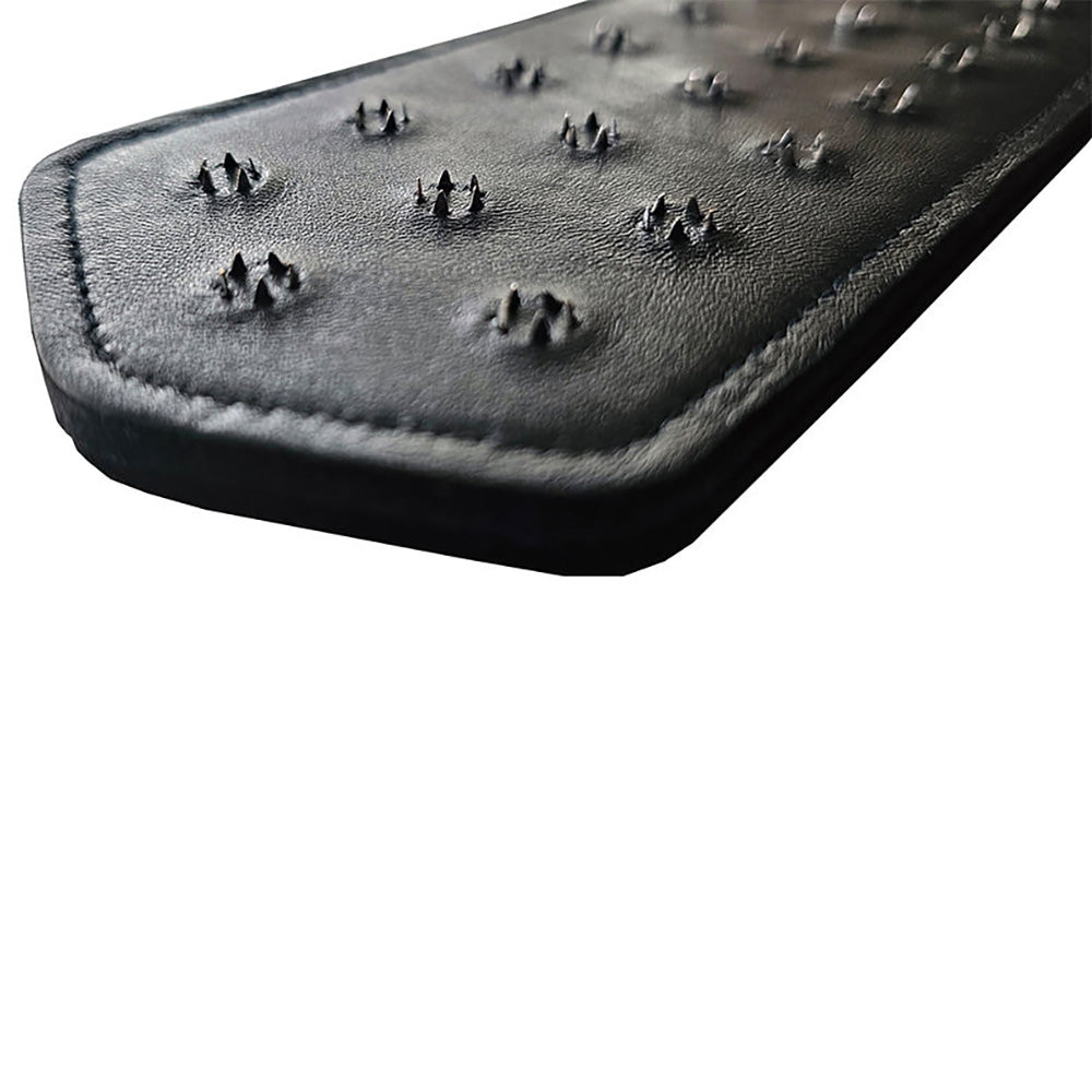 Black leather paddle with metal spikes.