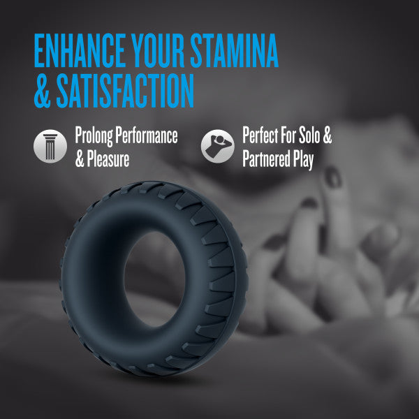 A dark grey textured silicone cock ring and ball stretcher.