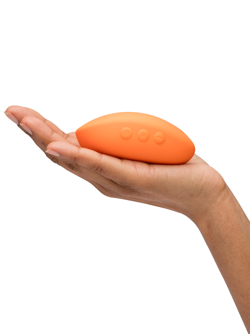 Orange lay-on vibrator with three control buttons held in a hand.