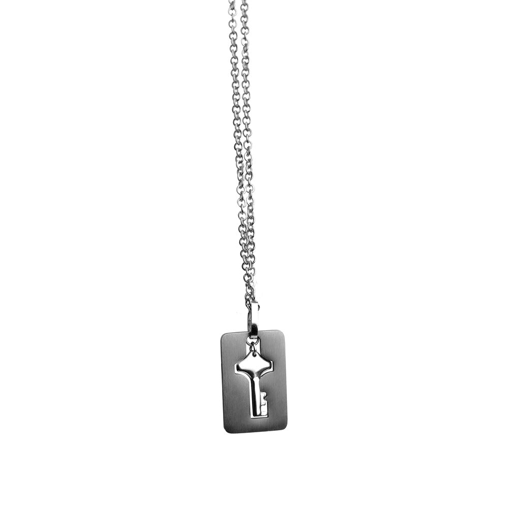Silver necklace with a rectangular pendant featuring a key cutout.