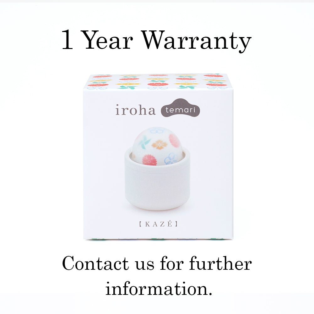 Iroha Kaze temari personal massager in a white holder.