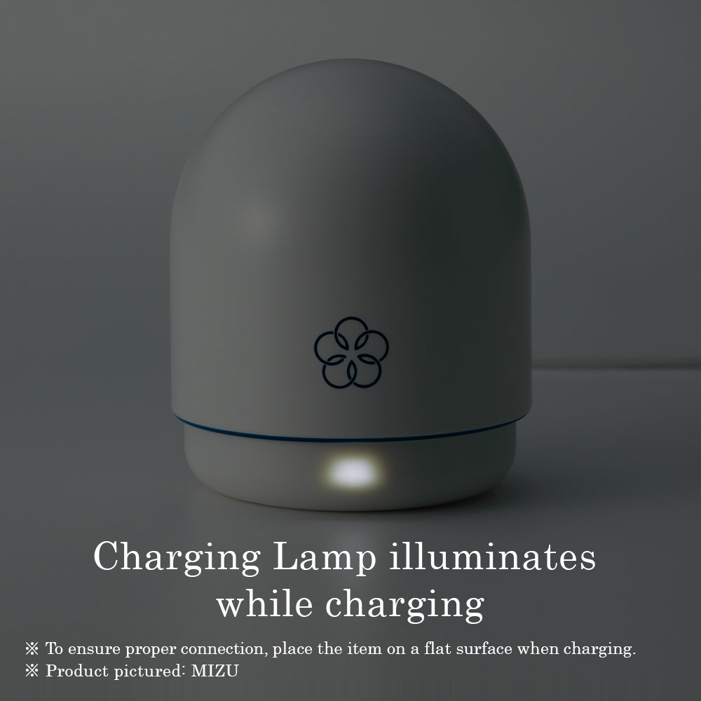 Mizu Temari rechargeable silicone massager with a charging indicator light.