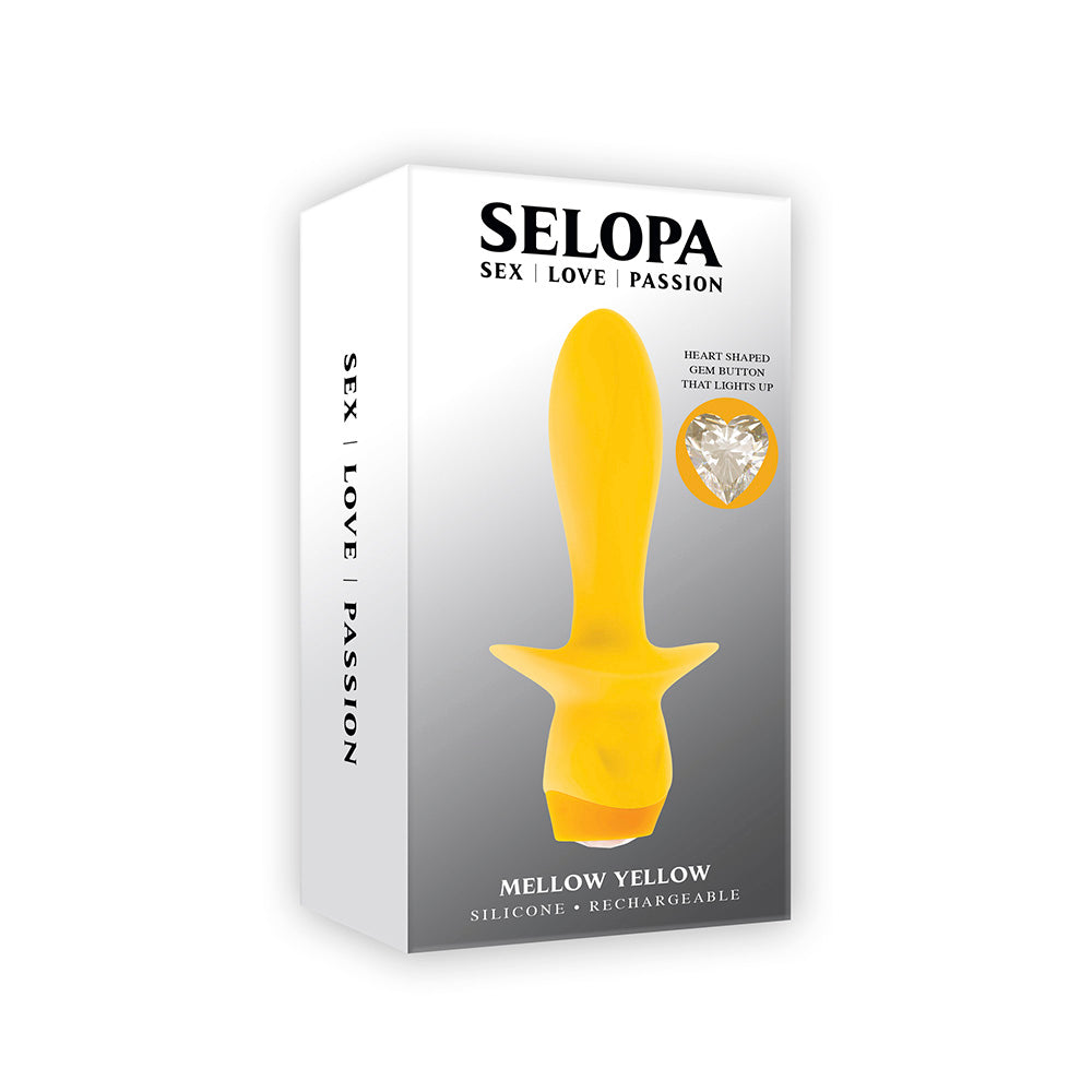 Yellow silicone vibrating plug with a heart-shaped gem button on a white and grey box.