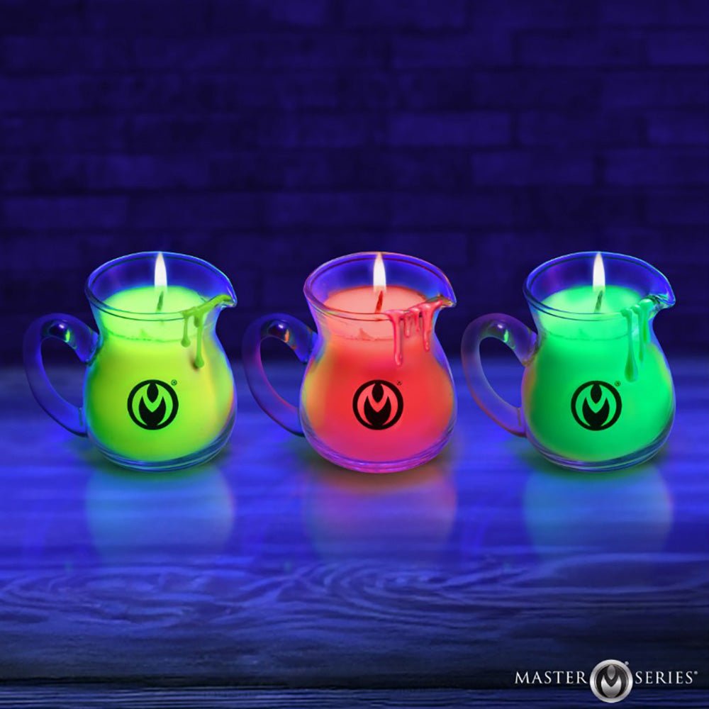 Three UV reactive neon wax play pitchers in red and green glow under blacklight.
