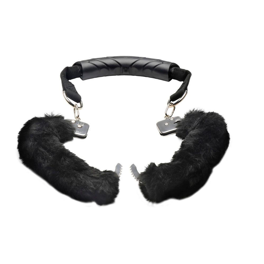 Black furry handcuffs with a textured handle and metal clasps.