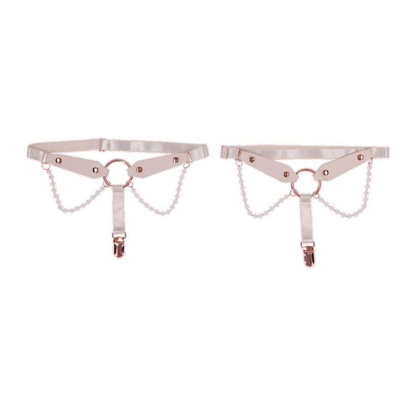 Pearl garter set with faux leather straps, rose gold rings, and pearl chains.